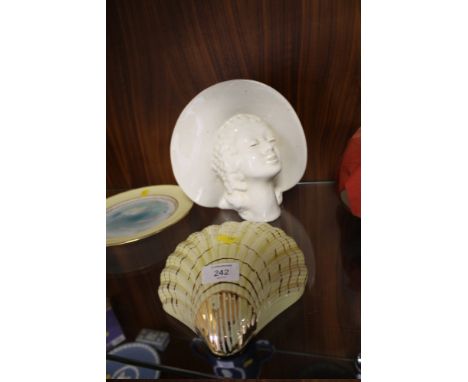TWO CERAMIC WALL POCKETS OF A BUST AND A SHELL