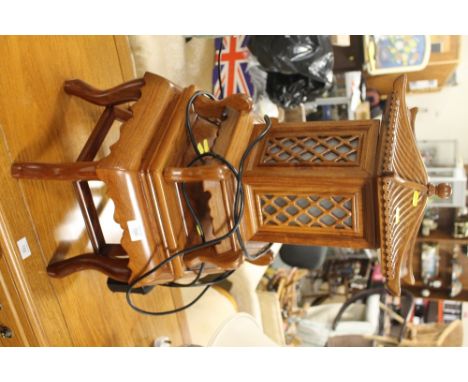 A CHINESE HARDWOOD TEMPLE LAMP ON STAND