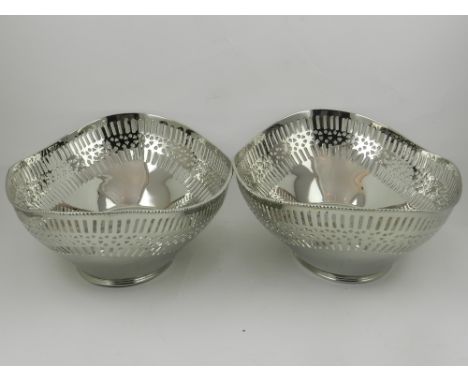 A pair of nickel plated serving bowls, having a pierced border, bears 'R. H. EP'. L.36cm