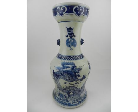 A Chinese Kangxi style blue and white hard paste porcelain vase, having dogs of Fo handles to sides, decorated with dragons c