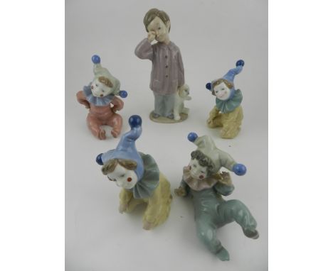 Four Nao Lladro porcelain figurines, modelled as children dressed as clowns, together with one other Nao figurine.