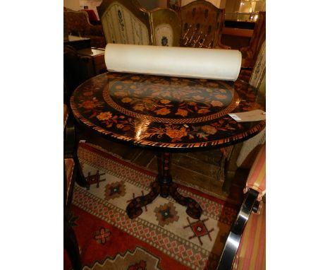 A 19th century marquetry inlaid circular tilt top table, raised on tripod base, H.77cm
