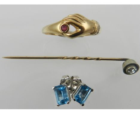 A yellow metal tie pin, stamped 375, together with a pair of white metal and blue stone earrings, and a yellow metal band rin