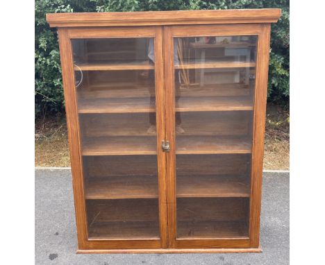 Pine 4 shelf, 2 Door glass fronted bookcase, approximate measurements: Height 46.5 inches, Width 47 inches, Depth 13.5 inches