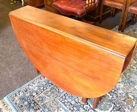 Teak slim gate leg table, measuring 29 inches in height, 42 inches in length and when the leaf is down it is 10 inches wide. 