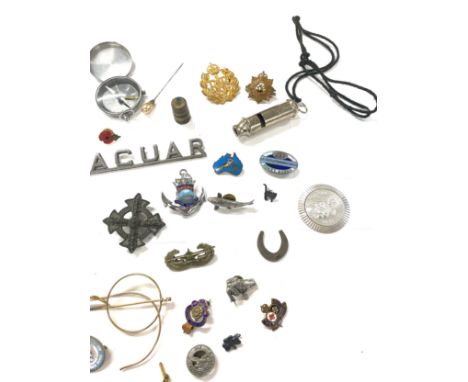 Selection of assorted collectable pieces to include vintage whistle, compass badges, car badges etc 