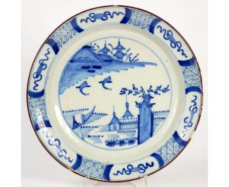A DUTCH DELFTWARE BLUE AND WHITE CHINOISERIE DISH, WITH BROWN ENAMEL RIM, 30CM DIAM, MID 18TH CENTURY
