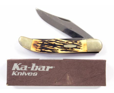 A KA-BAR FOLDING KNIFE WITH ANTLER SCALES AND NICKEL PLATED MOUNTS, UNUSED, BOXED