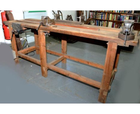 A 7FT TIMER WORKBENCH WITH RECORD VICE AND TWO BENCH VICES 
