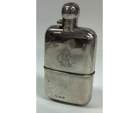A good shaped silver hinged top hip flask with removable cup. London. By SM&Co. Approx. 145 grams. Est. £100 - £150.