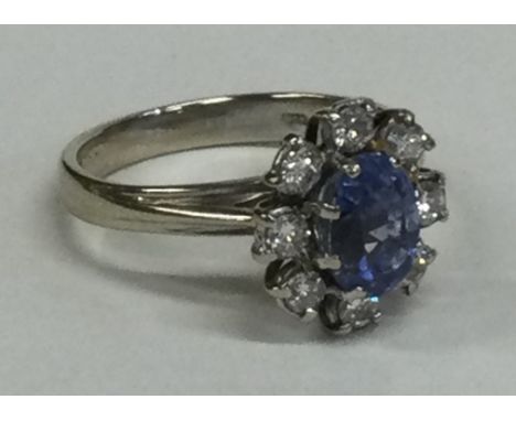 An 18 carat gold diamond set circular cluster ring. Approx. 5 grams. Est. £300 - £400.
