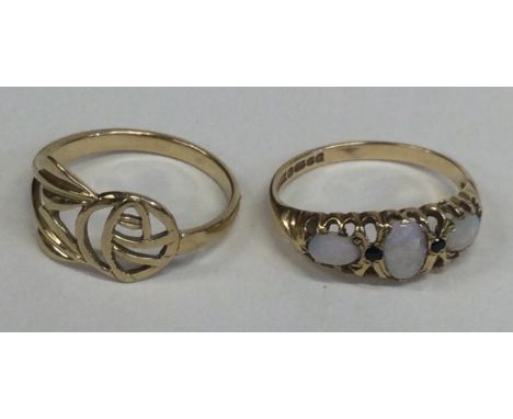 An opal three stone ring in 9 carat setting together with one other. Approx. 4 grams. Est. £60 - £80.