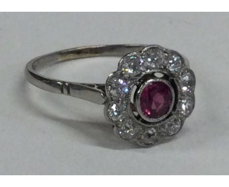 An attractive Victorian ruby daisy head cluster ring. Approx. 3 grams. Est. £300 - £400. 
