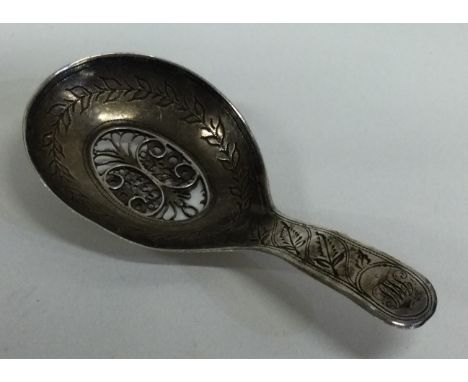 A small Georgian silver caddy spoon with filigree decoration. Birmingham. By Samuel Pemberton. Approx. 9 grams. Est. £30 - £5