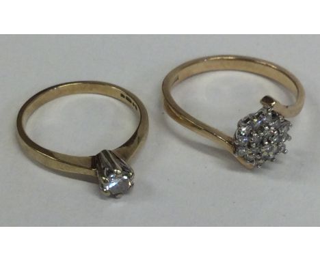 A diamond five stone ring in 18 carat gold setting together with a 9 carat example. Approx. 4 grams. Est. £60 - £80.