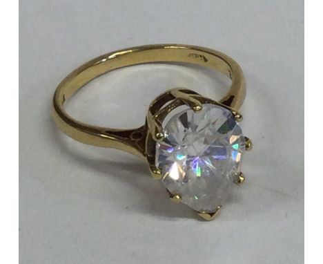 A small pear-shaped single stone ring in 18 carat gold setting. Approx. 5 grams. Est. £100 - £150.