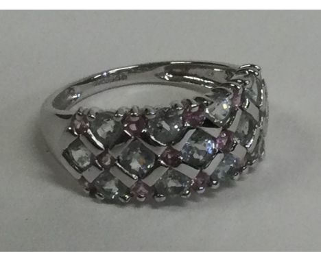 A large white gold three row ring. Approx. 3 grams. Est. £50 - £80.