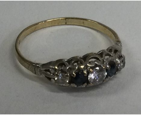 A small 9 carat five stone ring. Approx. 2 grams. Est. £30 - £50.