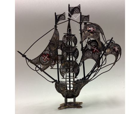 A Continental silver and enamelled model of a Galleon. Approx. 145 grams. Est. £120 - £150.