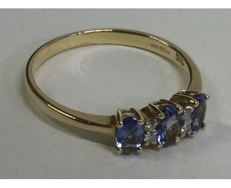 A small diamond five stone ring in 14 carat gold setting. Approx. 1 gram. Est. £20 - £30.