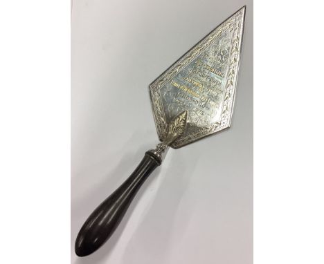 A silver plated trowel. Est. £20 - £30.