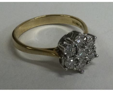 A good diamond seven stone cluster ring in 9 carat setting. Approx. 3 grams. Est. £50 - £80.