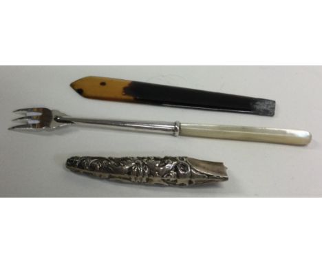 A Victorian silver and faux shell letter opener together with a silver and MOP pickle fork. Birmingham 1892. Approx. 16 grams
