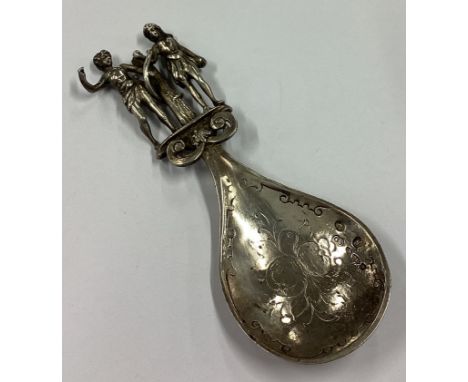 A Victorian silver caddy spoon cast with figural decoration to handle bearing import marks. Approx. 43 grams. Est. £50 - £80.