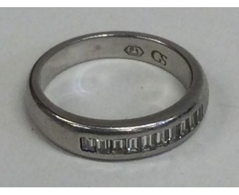 A good diamond baguette cut ring in platinum setting. Approx. 11 grams. Est. £200 - £250.