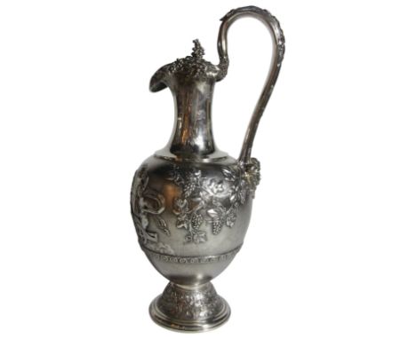 A large Victorian silver wine ewer. With classic Grecian chariot design amongst foliage &amp; vines. (H: 37cm), (1695 grams)