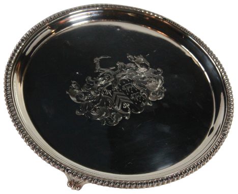A good silver salver with gadroon edge &amp; engraved armorial to center upon three shaped feet - (26cm Diameter), (602 grams