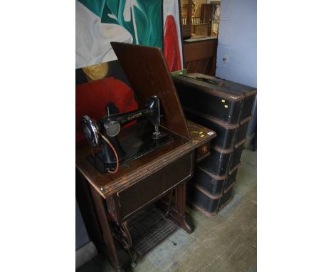 Treddle sewing machine and a trunk