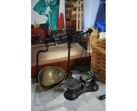 Two pairs of scales and a basket