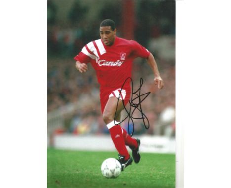 John Barnes Liverpool Signed 12 x 8 inch football photo. Good Condition. All autographs are genuine hand signed and come with