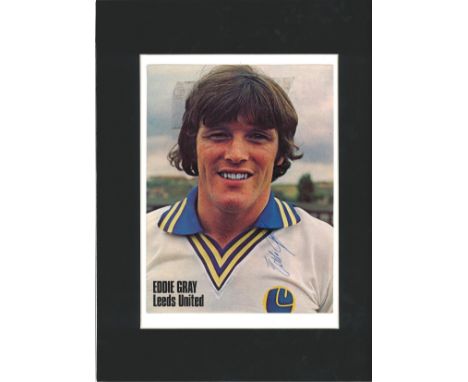 Football Eddie Gray signed 16 x 12 inch mounted colour magazine photo pictured in his Leeds United playing days. Good Conditi