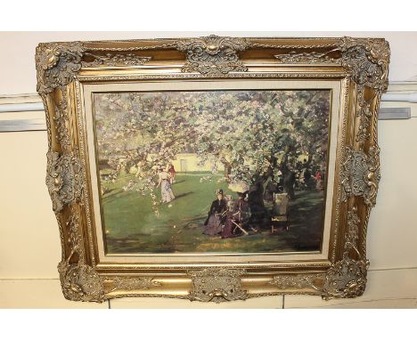A reproduction colour print of a French Impressionist painting depicting figures playing petanque beneath blossom trees, in o