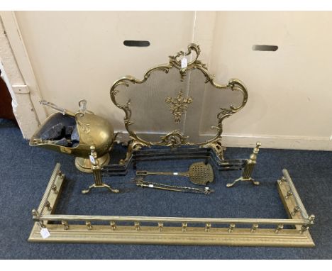 A large brass fire fender, with balustrade, decorated with leaves, 136cm, together with a brass mesh fire screen of rococo sc