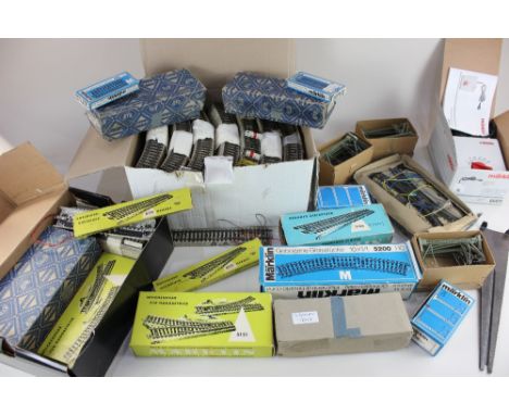 A collection of over two hundred pieces of Marklin HO gauge three-rail 'M' track, to include straights, small, medium and lar