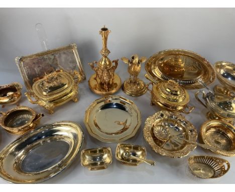 A collection of gold coloured metal ware, to include a candlestick formed as a bird, 23cm, and another on camel shaped suppor