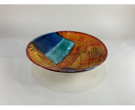 A Poole Pottery fruit bowl in the gemstones pattern, 34cm diameter