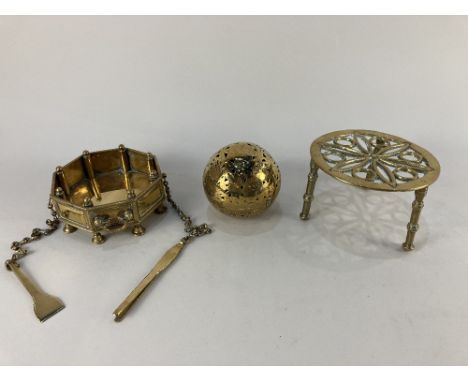 An Indian brass octagonal dish with pincers and small shovel, on column supports (two detached) by repute used as a table hea