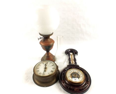 A Sestrel Brass ships clock, Mahogany barometer and Brass oil lamp