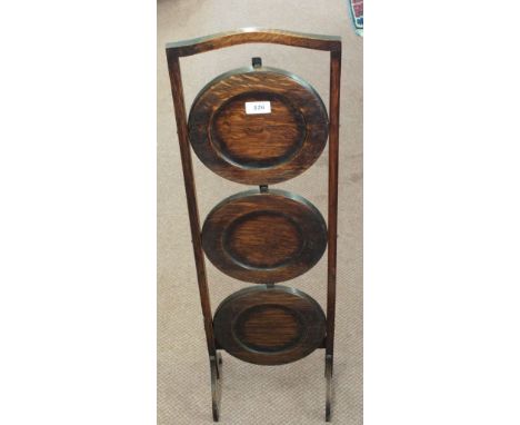 An Oak folding cake stand, mantel clock and a Dinky Supertoys elevator