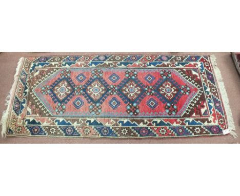 A Persian runner with repeating central design, 72" x 29"