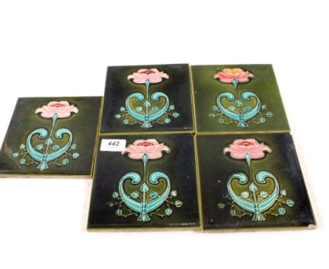A set of five Art Nouveau floral tiles
