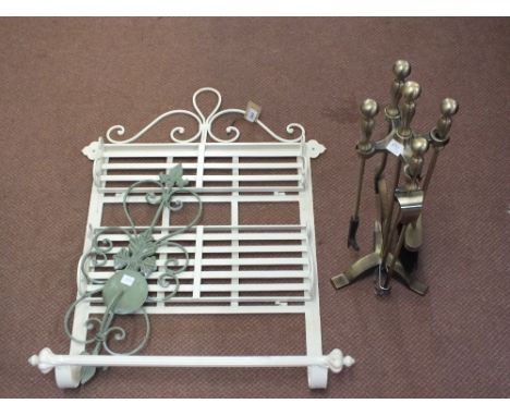 A two tier metal shelf, a wall candle holder and a companion set