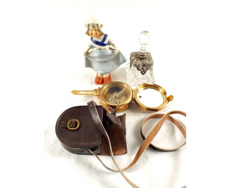 A Silver mounted scent bottle, a porcelain nodding figurine and a Brass marine compass