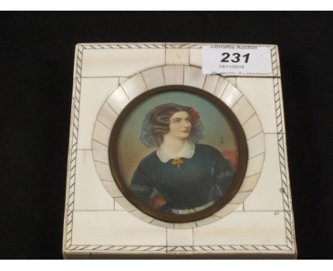 An Ivory framed miniature half length portrait of a lady