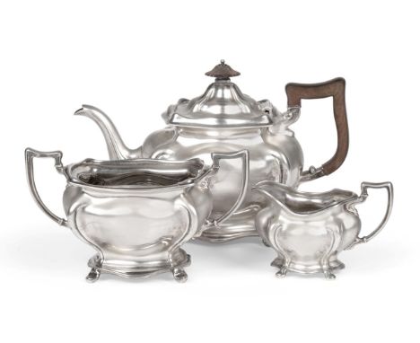 An Edwardian Silver Three Piece Tea Service, Joseph Rodgers & Sons, Sheffield 1909, the plain rectangular bodies of bombé for