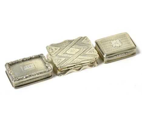 A Group of Three Silver Vinaigrettes Comprising:  Edward Smith, Birmingham 1864, rectangular with a shaped profile and bright
